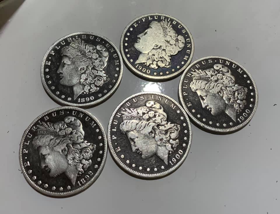A matching set of Morgan dollars with uniform patina